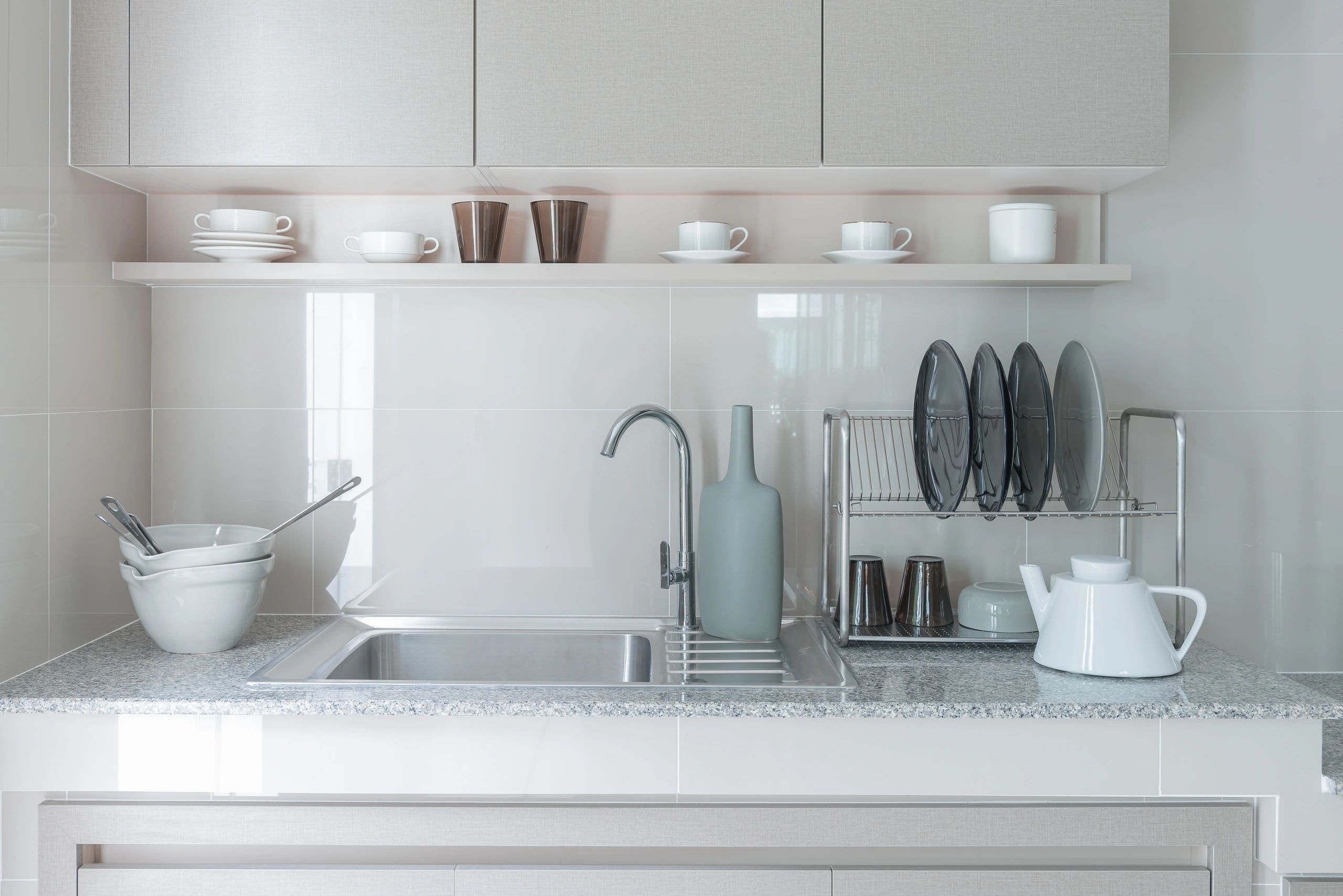 Minimalist kitchen sink area — end of lease cleaning