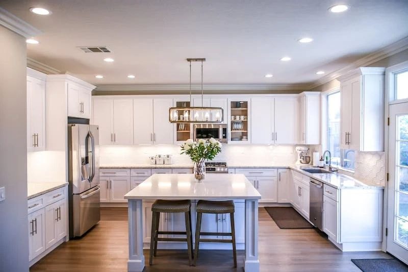 Modern kitchen with white cabinets — general home cleaning